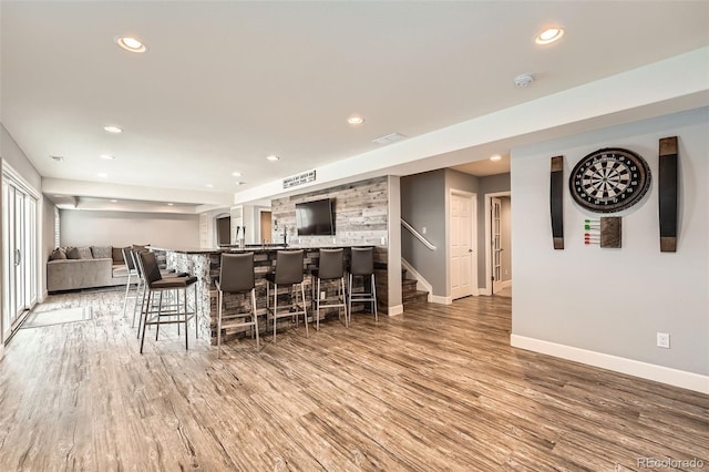 bar featuring hardwood / wood-style flooring