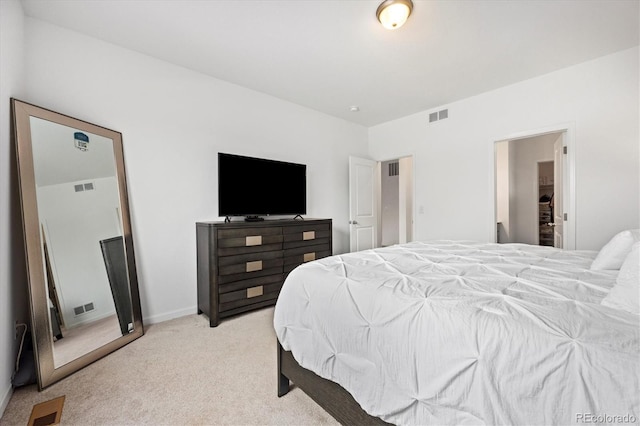 bedroom with light colored carpet