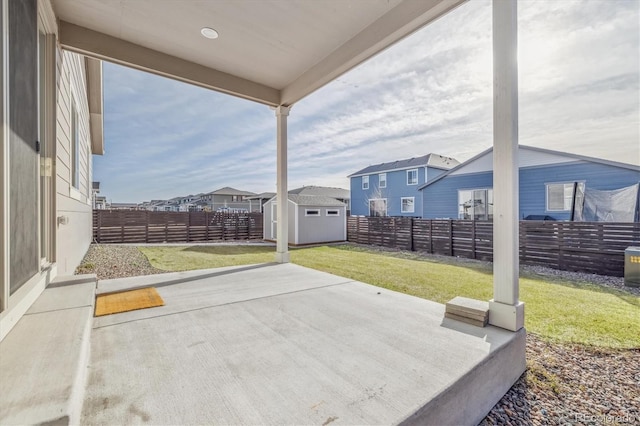 view of patio with a storage shed