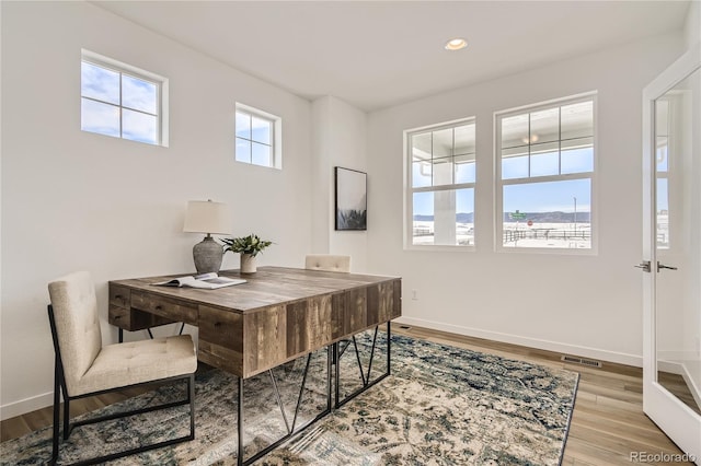 dining area with visible vents, recessed lighting, baseboards, and wood finished floors