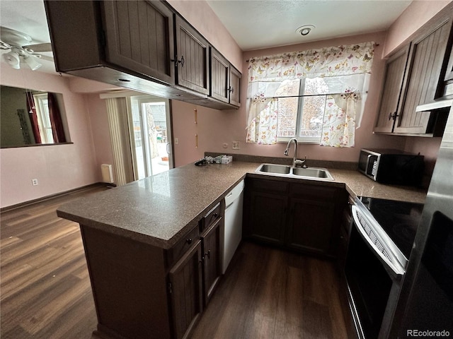 kitchen with dishwasher, sink, kitchen peninsula, electric stove, and dark brown cabinets