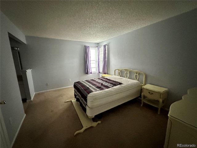 carpeted bedroom with a textured ceiling