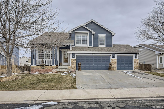 view of front of home with a garage and a front lawn