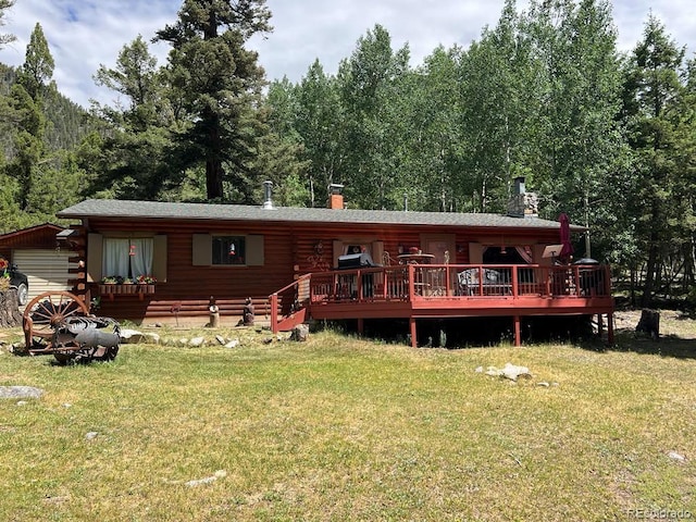 22585 County Road 292, Nathrop, CO 81236 - back of house with log siding, a lawn, a deck, and a chimney