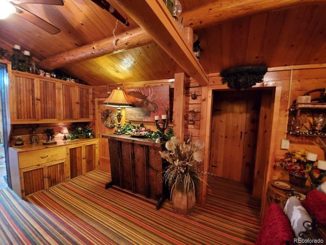 22585 County Road 292, Nathrop, CO 81236 - kitchen with wooden ceiling, wood walls, carpet flooring, ceiling fan, and brown cabinetry