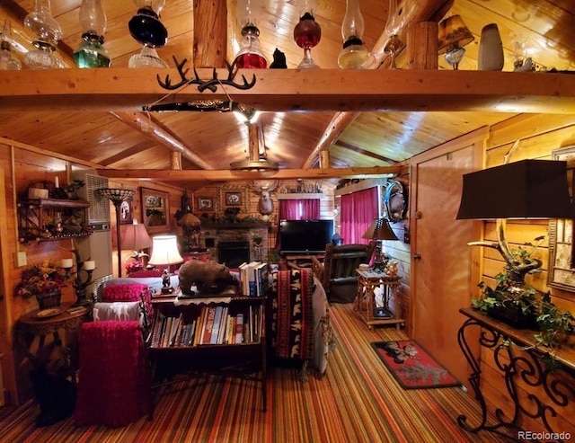 22585 County Road 292, Nathrop, CO 81236 - carpeted living room with wood ceiling, wooden walls, and a fireplace