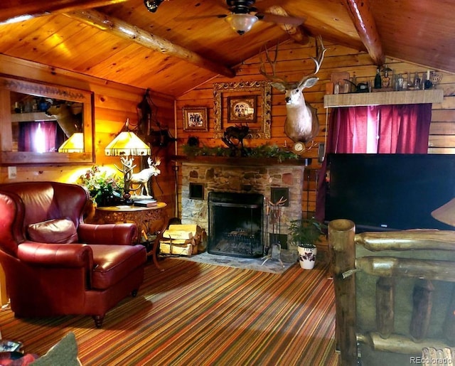 22585 County Road 292, Nathrop, CO 81236 - living room featuring wood ceiling, ceiling fan, a stone fireplace, wooden walls, and carpet