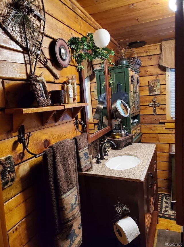 22585 County Road 292, Nathrop, CO 81236 - bathroom featuring wood walls, wooden ceiling, vanity, and wood finished floors