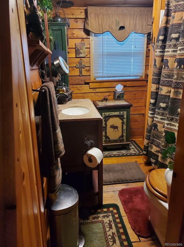 22585 County Road 292, Nathrop, CO 81236 - bathroom featuring wood walls, vanity, wood finished floors, and curtained shower