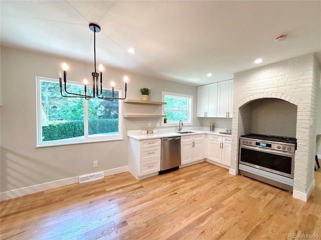 7160 E Iliff Ave, Denver, CO 80224 - kitchen featuring stainless steel appliances, white cabinets, light countertops, light wood-style flooring, and recessed lighting