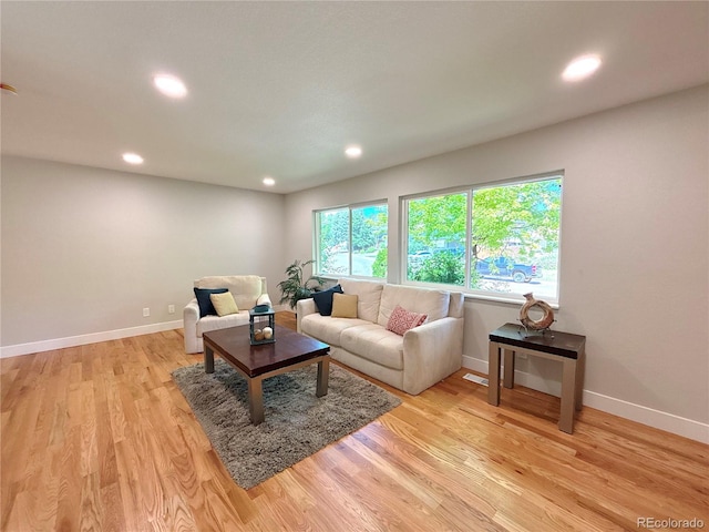 7160 E Iliff Ave, Denver, CO 80224 - living room featuring light wood-style floors and recessed lighting
