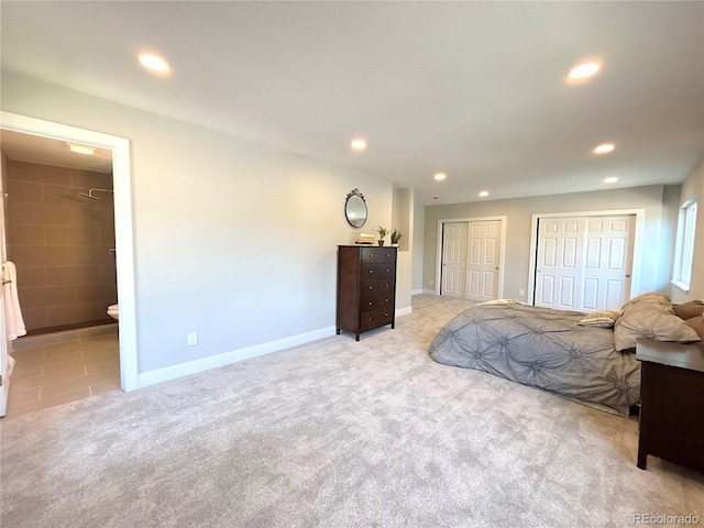 7160 E Iliff Ave, Denver, CO 80224 - bedroom with two closets, recessed lighting, light colored carpet, and connected bathroom