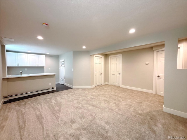 7160 E Iliff Ave, Denver, CO 80224 - finished below grade area with recessed lighting, carpet, and baseboard heating
