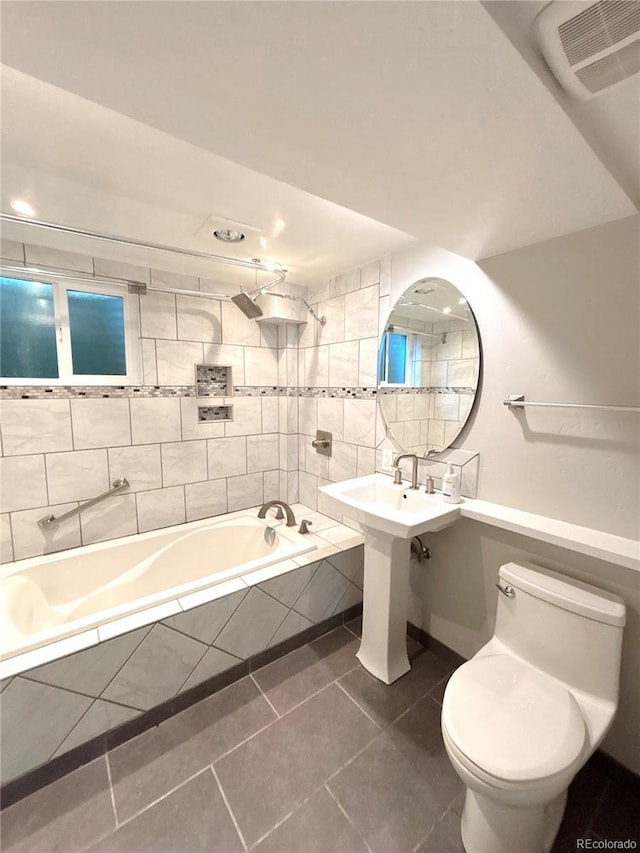 7160 E Iliff Ave, Denver, CO 80224 - bathroom featuring tile patterned floors and tiled shower / bath combo