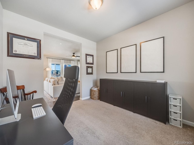 office area featuring light colored carpet and ceiling fan