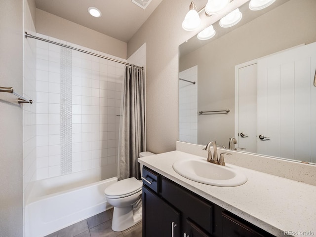 full bathroom featuring vanity, shower / bath combo, tile patterned floors, and toilet