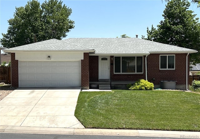 1152 S Eaton St, Lakewood, CO 80232 - ranch-style home featuring a garage, driveway, brick siding, and roof with shingles