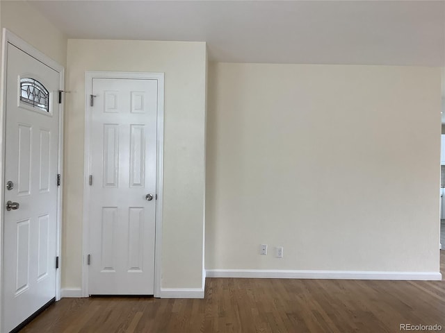 1152 S Eaton St, Lakewood, CO 80232 - unfurnished bedroom featuring baseboards and dark wood-style floors