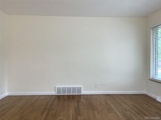 1152 S Eaton St, Lakewood, CO 80232 - unfurnished room featuring wood finished floors, baseboards, and plenty of natural light