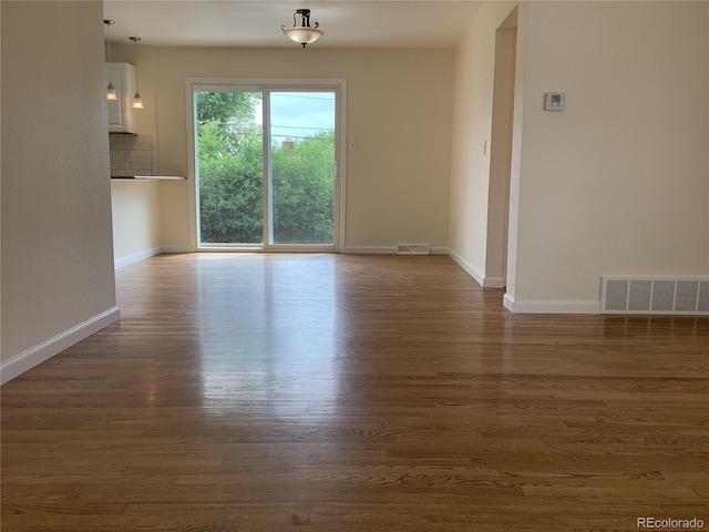 1152 S Eaton St, Lakewood, CO 80232 - unfurnished room featuring dark wood-type flooring and baseboards