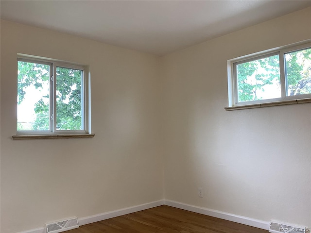 1152 S Eaton St, Lakewood, CO 80232 - spare room featuring wood finished floors and baseboards