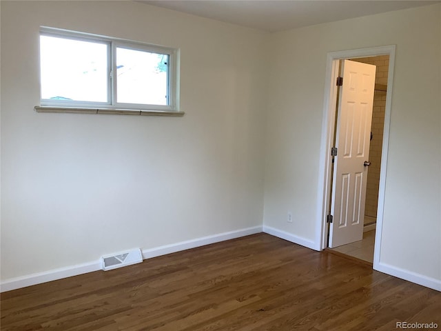 1152 S Eaton St, Lakewood, CO 80232 - empty room with wood finished floors and baseboards