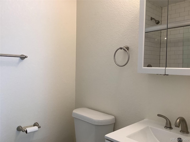1152 S Eaton St, Lakewood, CO 80232 - full bath with toilet, a sink, and tiled shower