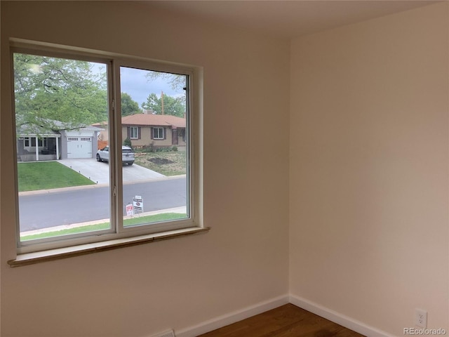 1152 S Eaton St, Lakewood, CO 80232 - empty room featuring baseboards and wood finished floors