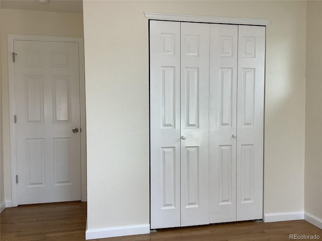 1152 S Eaton St, Lakewood, CO 80232 - unfurnished bedroom with a closet, wood finished floors, and baseboards