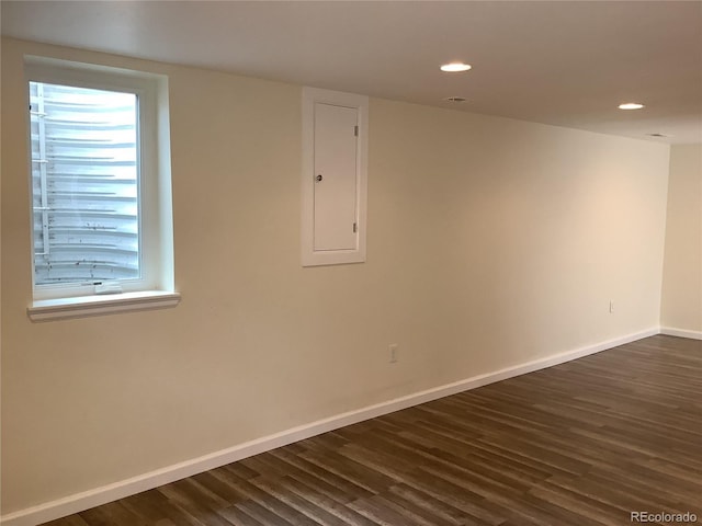 1152 S Eaton St, Lakewood, CO 80232 - unfurnished room featuring dark wood-style flooring, electric panel, baseboards, and recessed lighting