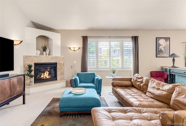 carpeted living room with a fireplace