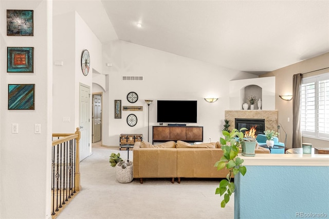 living room featuring vaulted ceiling and carpet