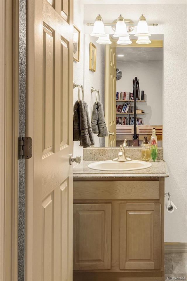 bathroom featuring tile patterned floors and vanity