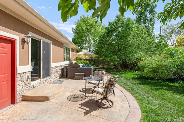 view of patio with a hot tub