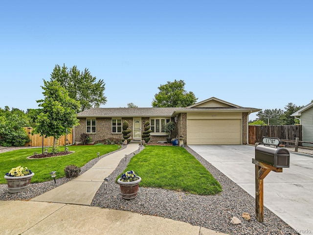 11707 W 65th Cir, Arvada, CO 80004 - single story home with a garage, driveway, and brick siding