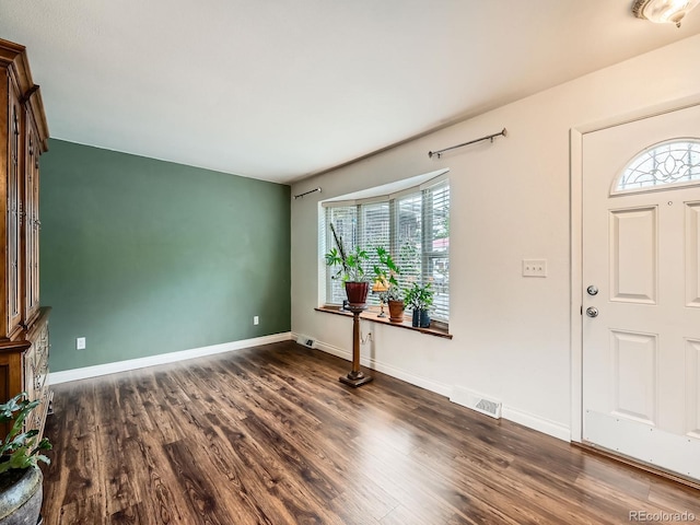 11707 W 65th Cir, Arvada, CO 80004 - entrance foyer with dark wood-type flooring and baseboards