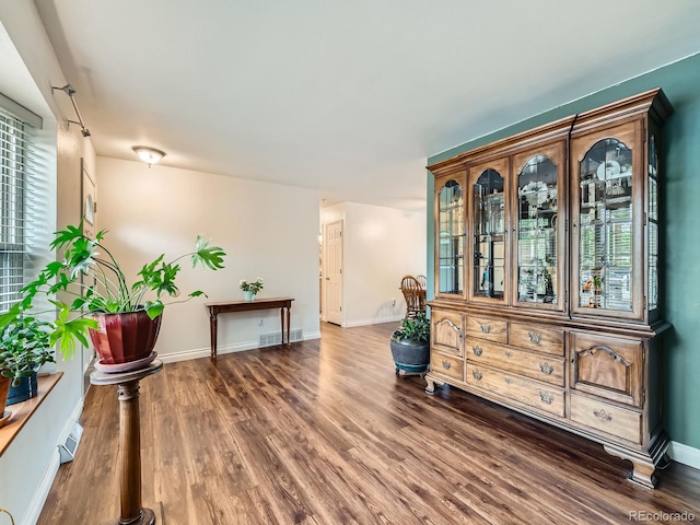 11707 W 65th Cir, Arvada, CO 80004 - living area with wood finished floors, baseboards, and plenty of natural light