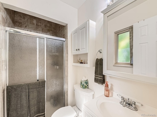 11707 W 65th Cir, Arvada, CO 80004 - full bath featuring a shower stall, toilet, and vanity