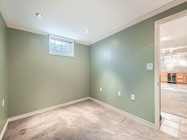 11707 W 65th Cir, Arvada, CO 80004 - spare room with carpet flooring, crown molding, beverage cooler, baseboards, and recessed lighting