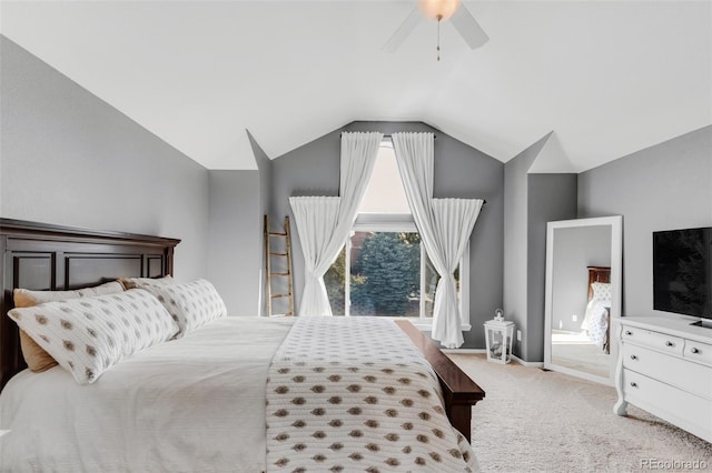 bedroom featuring carpet, vaulted ceiling, baseboards, and ceiling fan