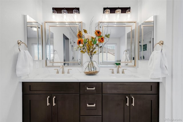 bathroom featuring double vanity and a sink