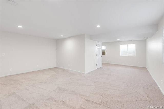 interior space with recessed lighting, baseboards, and light colored carpet