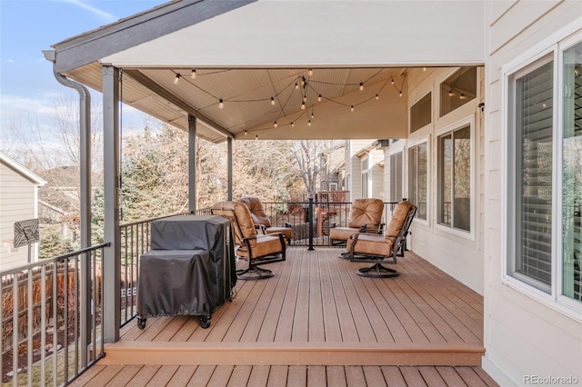 wooden terrace featuring grilling area