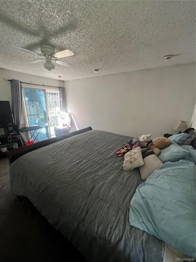 bedroom featuring a textured ceiling and ceiling fan