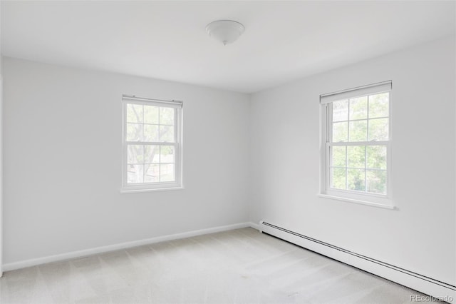 6982 Estes Dr, Arvada, CO 80004 - empty room with a baseboard heating unit, light carpet, and baseboards