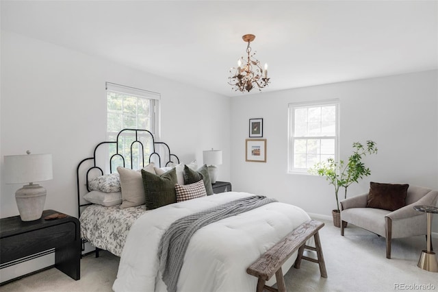 6982 Estes Dr, Arvada, CO 80004 - bedroom with light colored carpet, a chandelier, baseboard heating, and baseboards