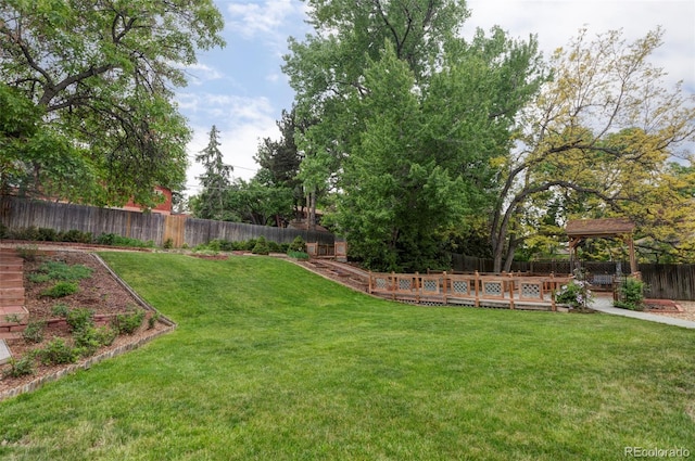 6982 Estes Dr, Arvada, CO 80004 - view of yard featuring a wooden deck