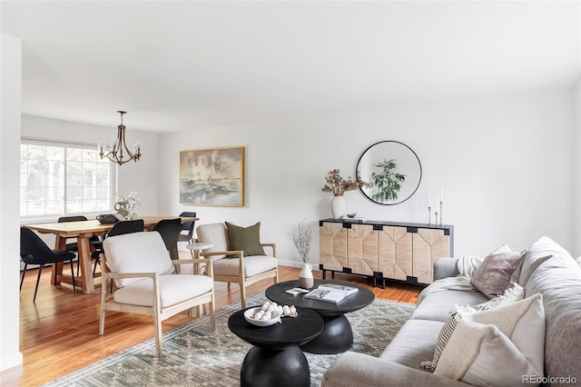 6982 Estes Dr, Arvada, CO 80004 - living area with wood finished floors and a chandelier