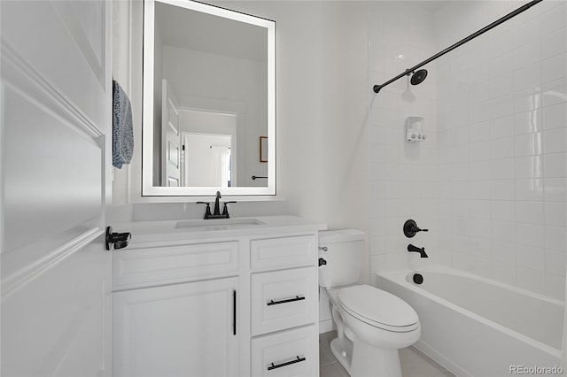 full bathroom with tiled shower / bath, vanity, and toilet