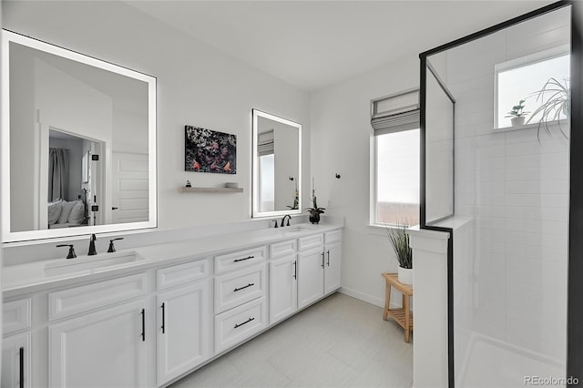 bathroom featuring vanity and tiled shower